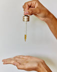 Premium Natural Oil for face. Moringa oil benefits. Gold benefits for health and beauty.