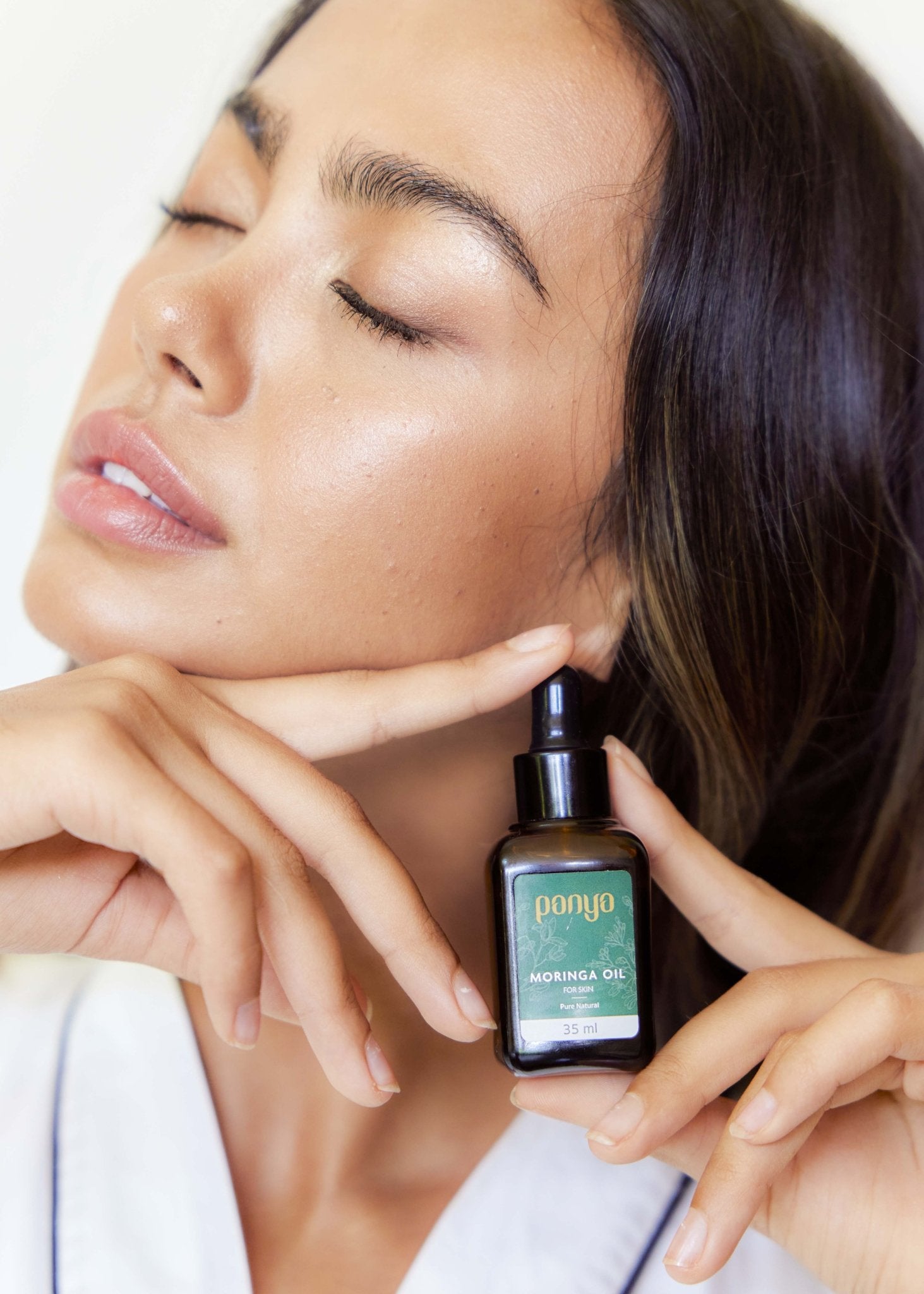 Panya 100% Moringa Oil: vegan Thai-grown cold-pressed virgin moringa oil with 46 antioxidants for strong, smooth skin. 