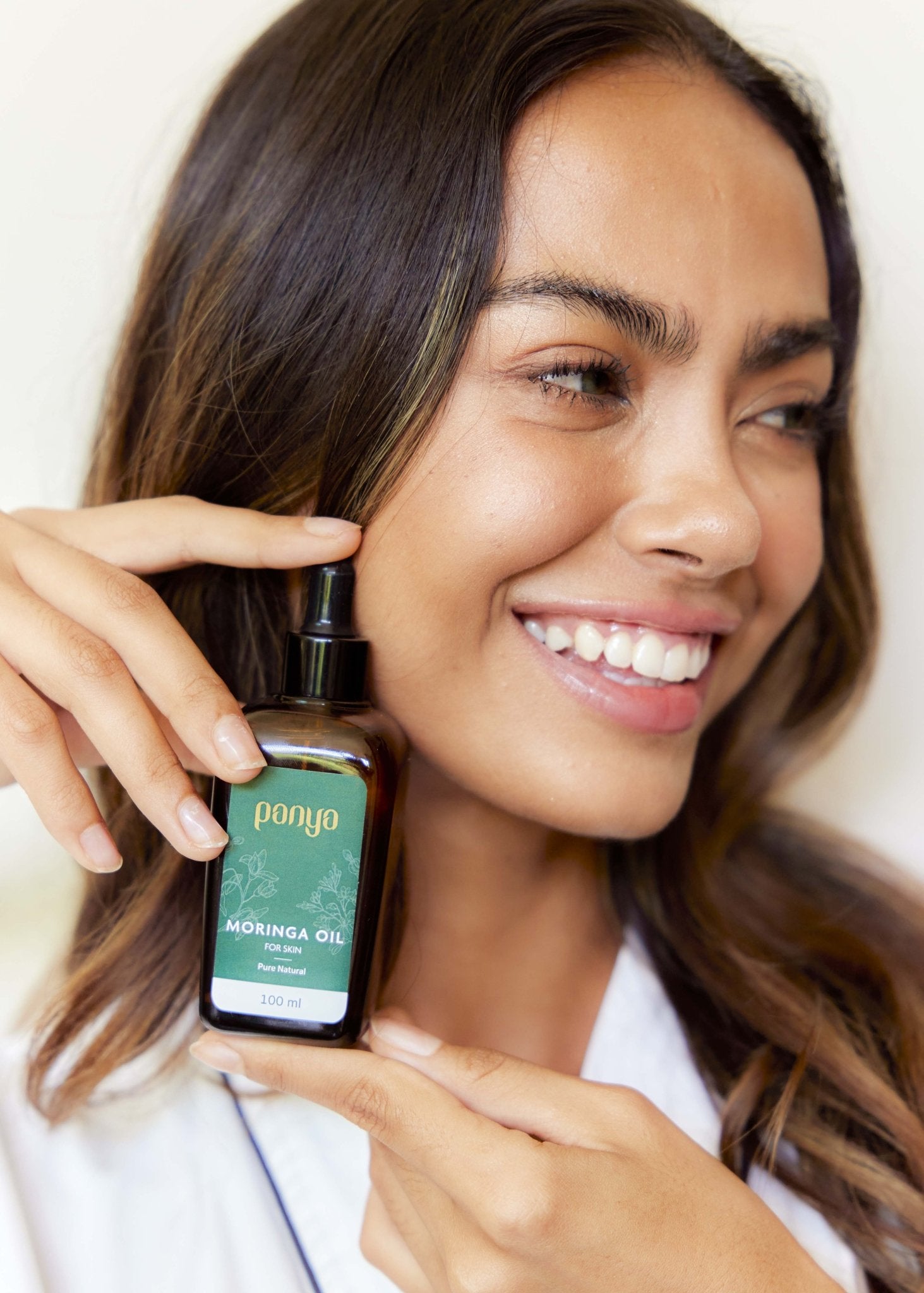 Panya 100% Moringa Oil: vegan Thai-grown cold-pressed virgin moringa oil with 46 antioxidants for strong, smooth skin. 