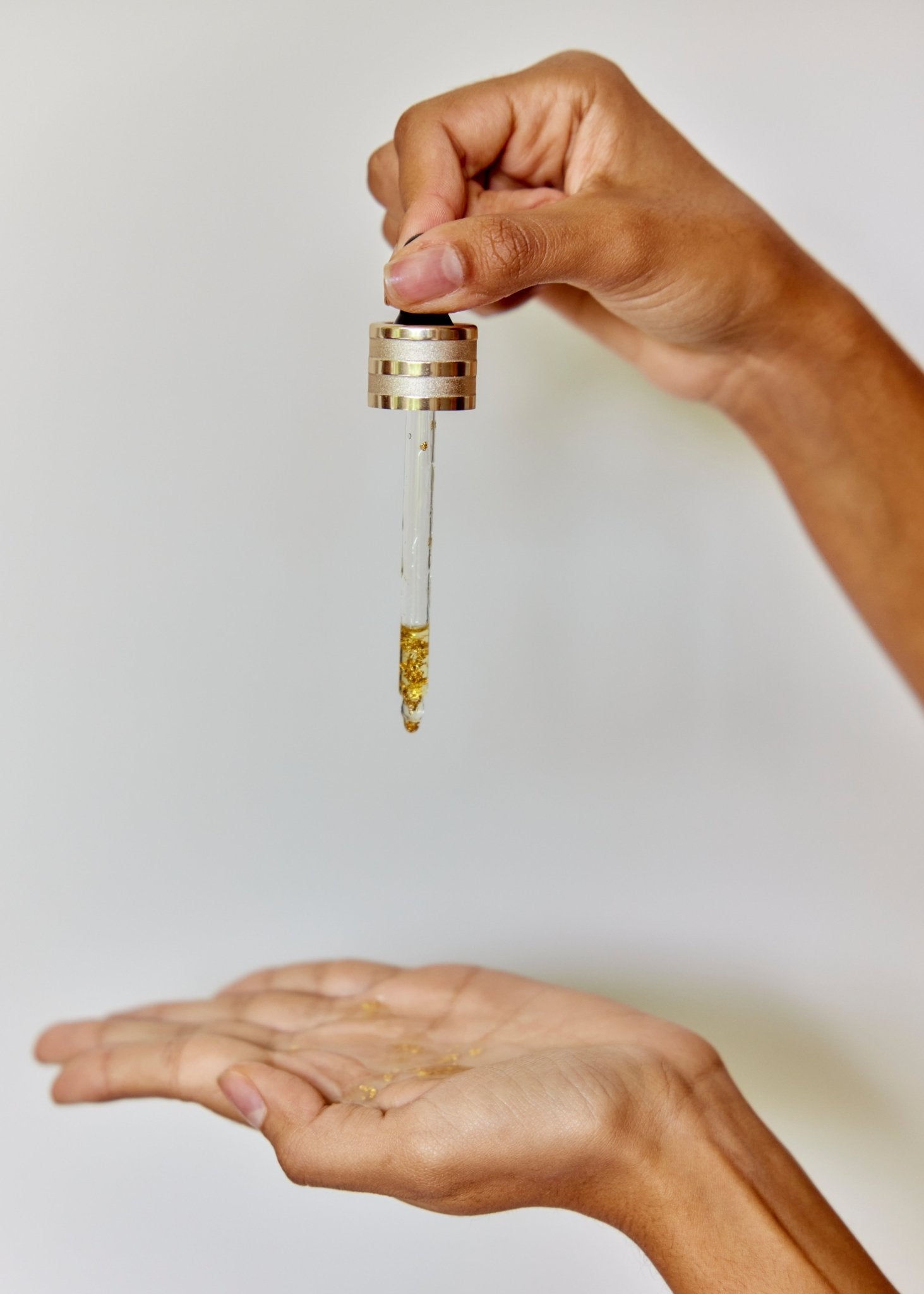 Premium Natural Oil for face. Moringa oil benefits. Gold benefits for health and beauty.