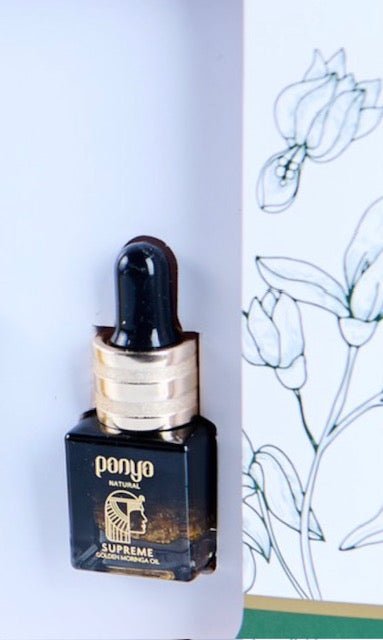 Panya Supreme Golden Moringa Oil: organic, concentrated rejuvenation with 24k gold, Thai moringa & other premium essential oils.