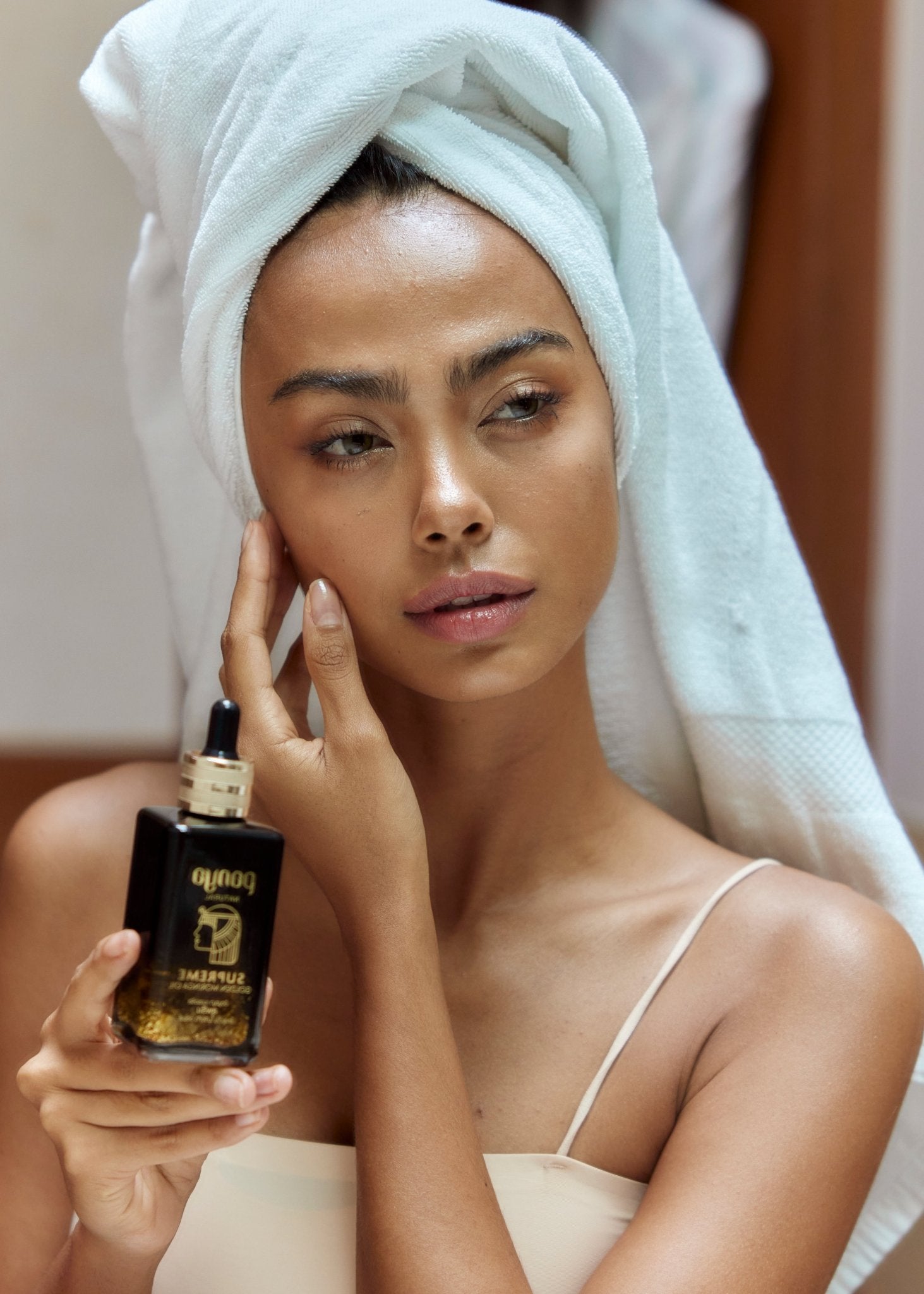 Panya Supreme Golden Moringa Oil: organic, concentrated rejuvenation with 24k gold, Thai moringa & other premium essential oils.